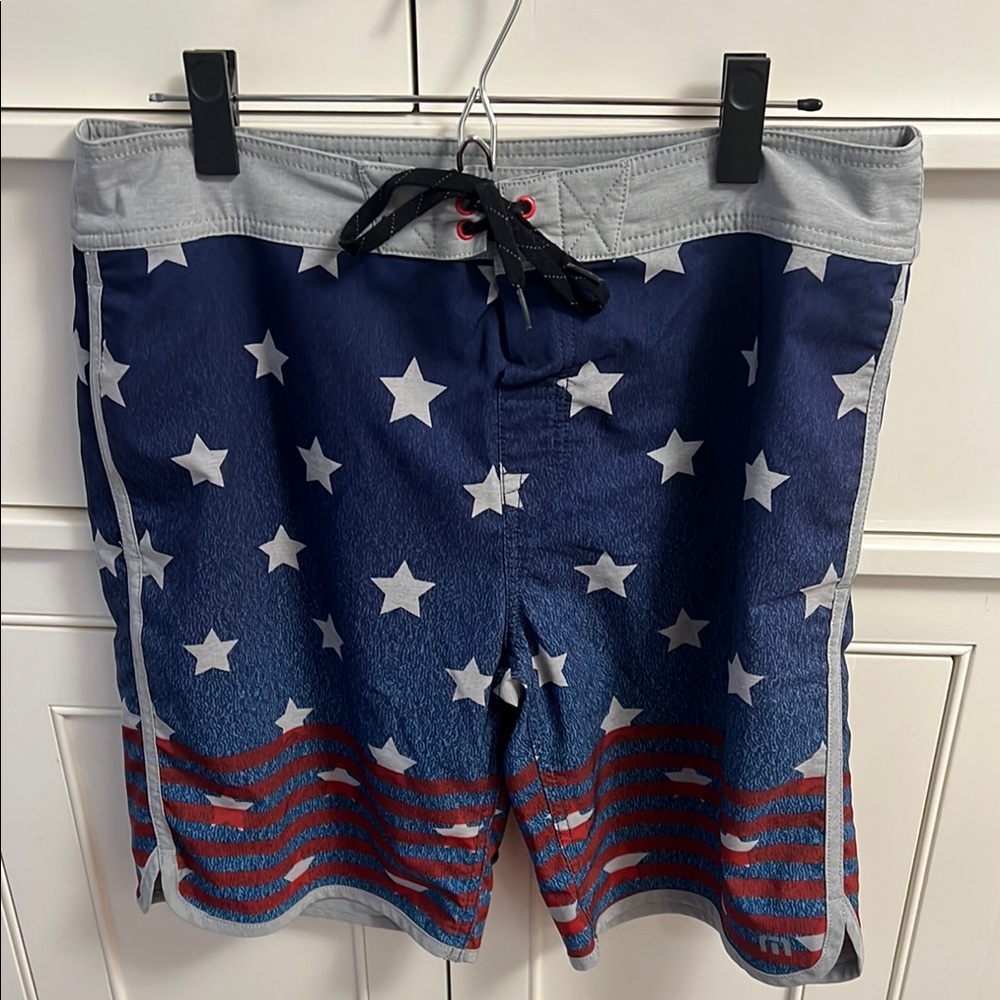 Travis Mathew Blue and White Board Shorts with Nautical Flair
